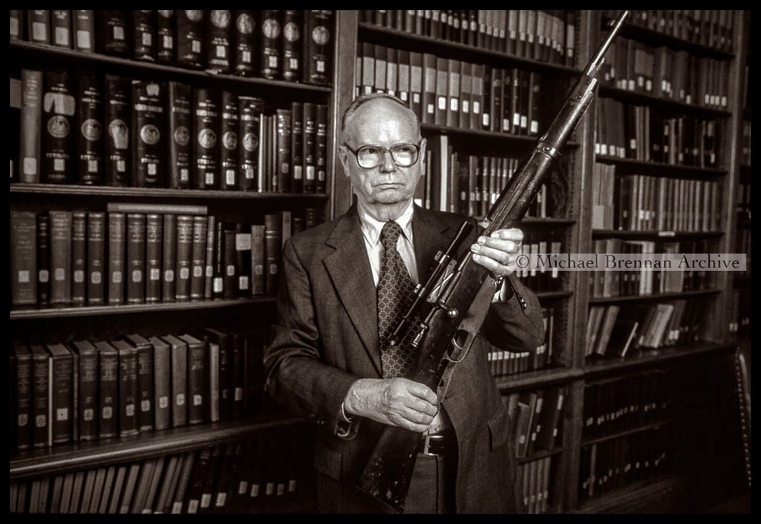 Curator Marion Johnson Displaying the Carcano Rifle — Washington, D.C. · 1984