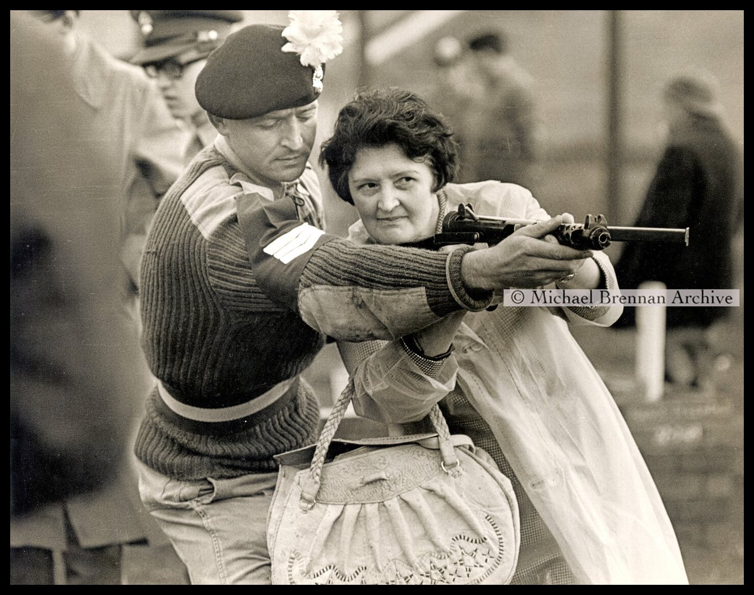 Housewife Learning Sten-gun — Lancashire, England · 1967